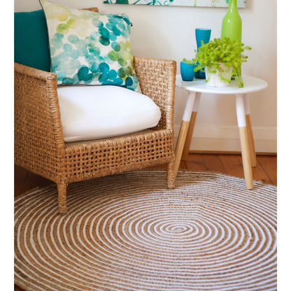 Plumeria Round Jute Rug in a room